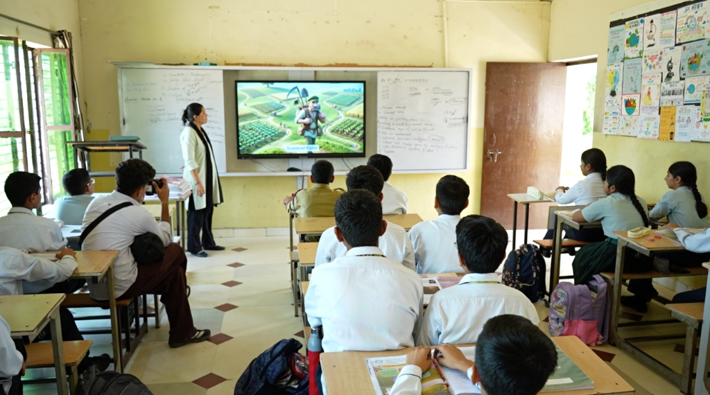 Teacher teaching students in classroom with an Edubull interactive smart panel